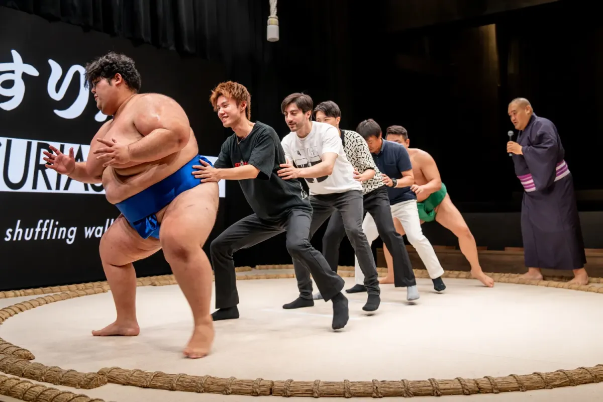 Retired professional sumo wrestlers performing a live show in Osaka with an audience ring challenge